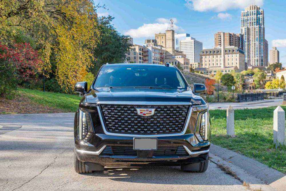 MN Black Car Cadillac Escalade ESV, front quarter view