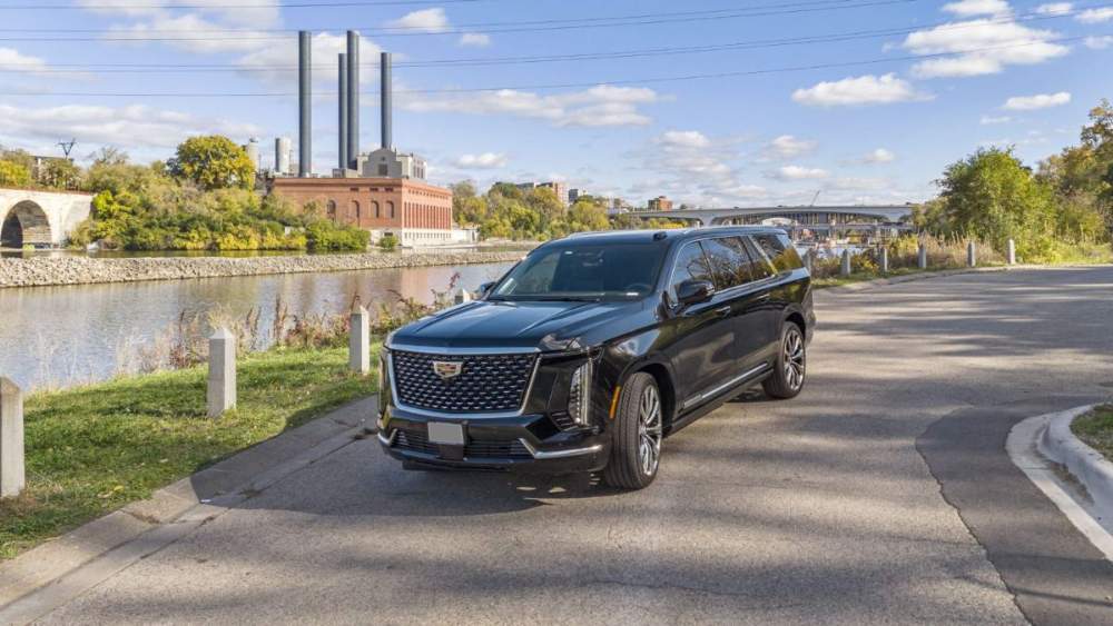 MN Black Car Cadillac Escalade ESV, riverside view