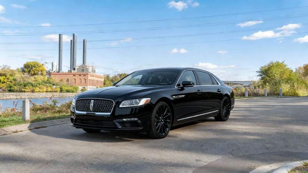 MN Black Car Lincoln Continental executive sedan, riverside view
